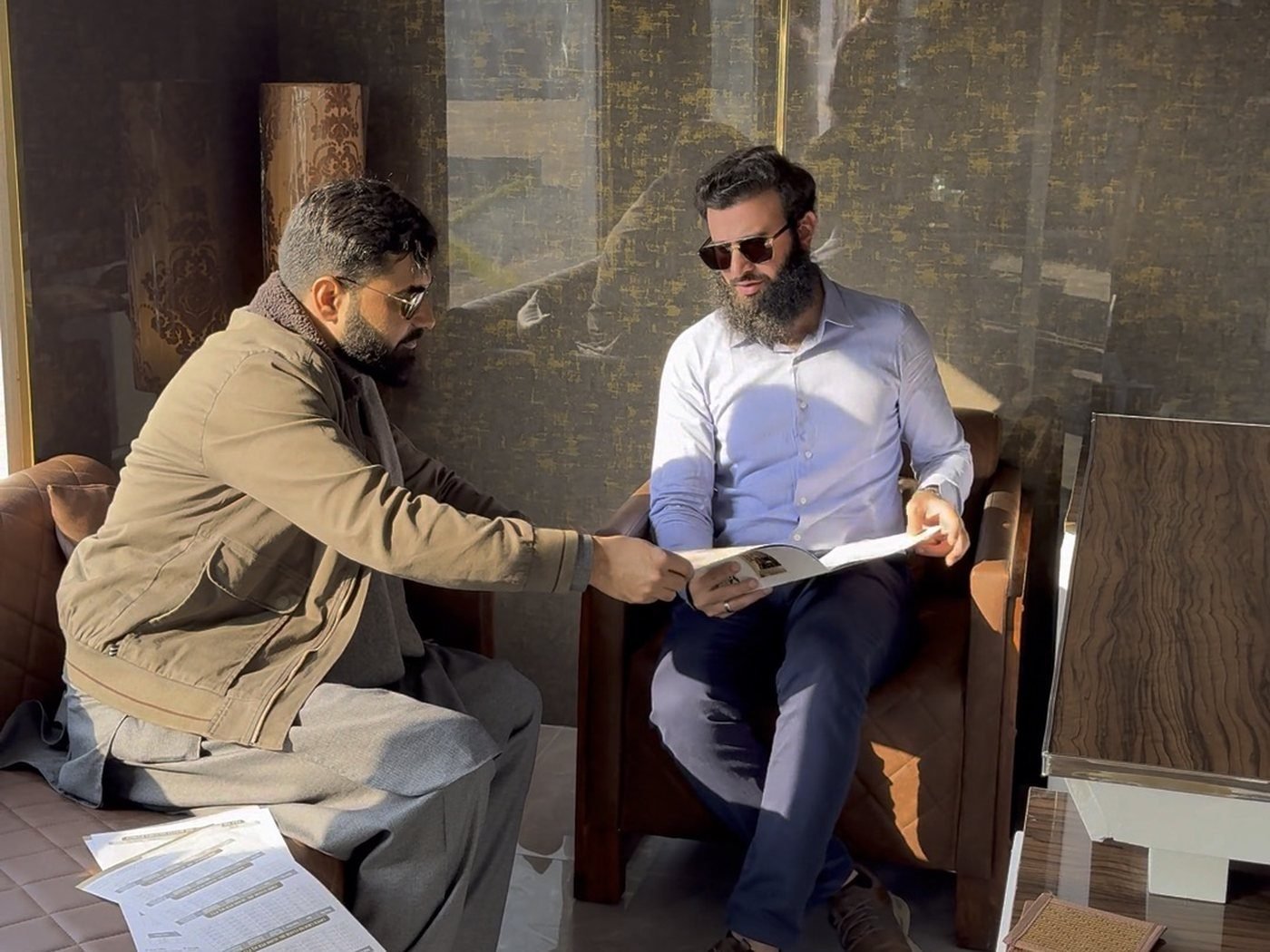 Going through documents at the G & S Builders office in Islamabad