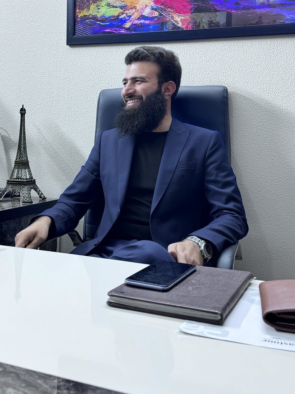 Zahid Gul, Founder and Managing Director of G & S Builders, at his desk in Islamabad