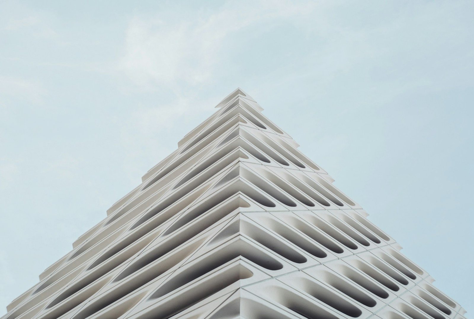 A concrete facade rising against the sky