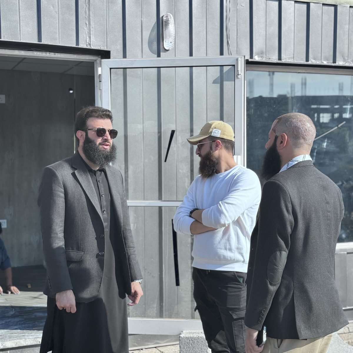 Zahid Gul in conversation outside the Gul Heights 2 booking office in Islamabad